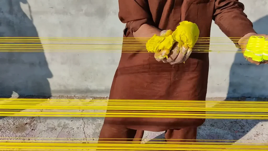 dor craftsman pasting manjha to sharp yellow color dor basantmela.com pakistan